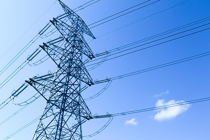 Suspension insulators support transmission lines on steel towers