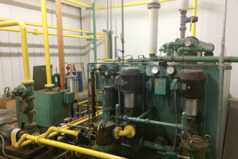 This is a photograph of the oil circulation system with automated control units that contribute to CO2 reduction at NGK Metals.
